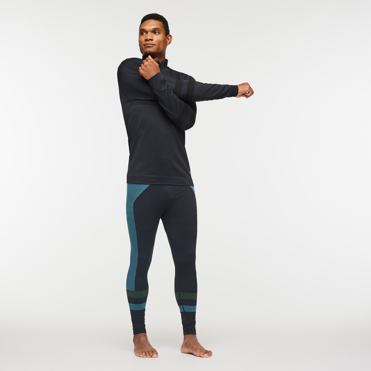 Debajo Seamless Baselayer Quarter-Zip - Men's, Cotopaxi Black, Model Jason