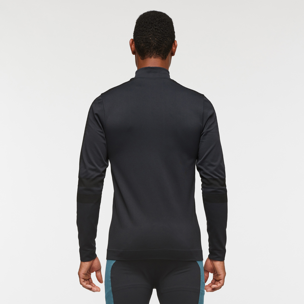 Debajo Seamless Baselayer Quarter-Zip - Men's, Cotopaxi Black, Model Jason