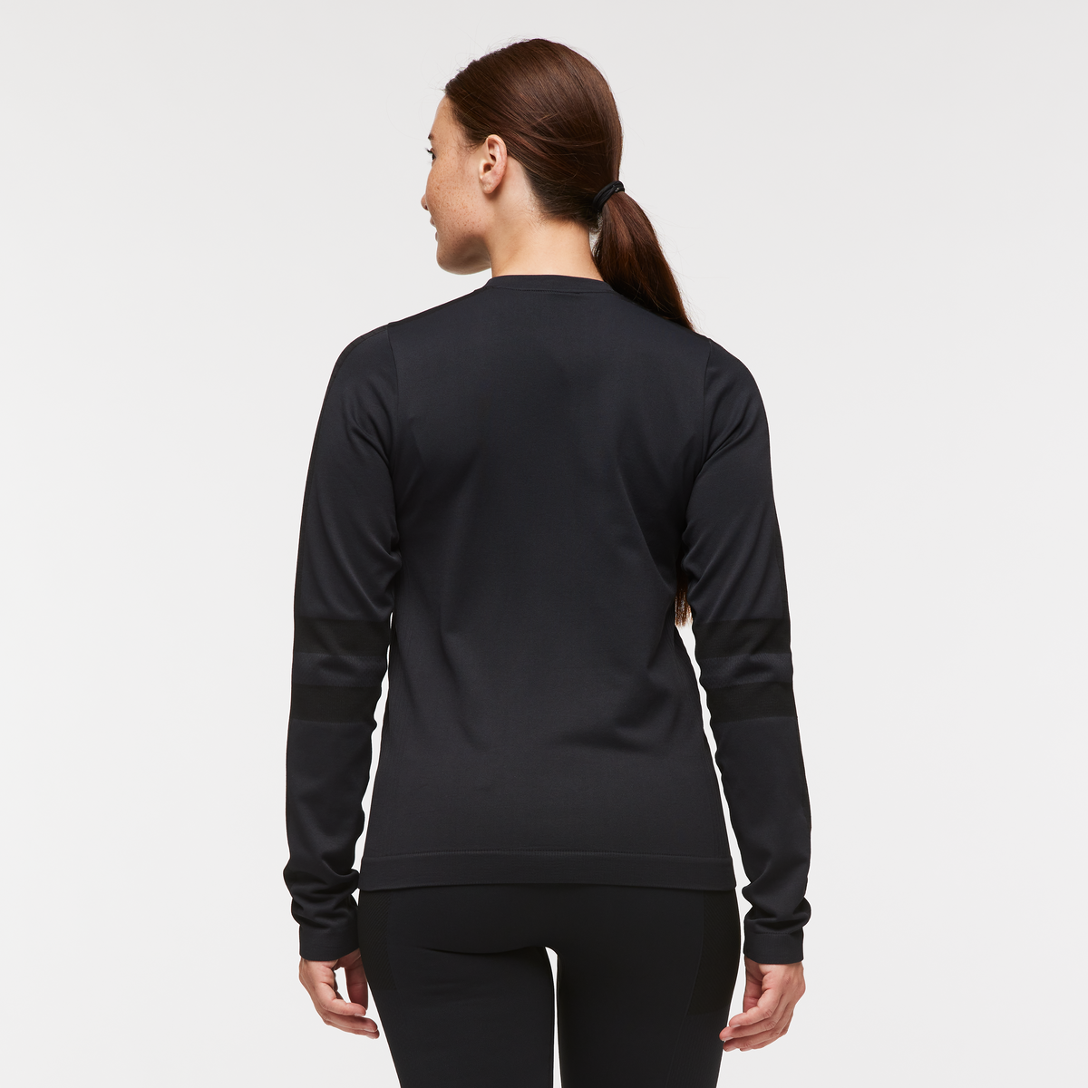 Debajo Seamless Baselayer Crew - Women's, Cotopaxi Black, Model Aya