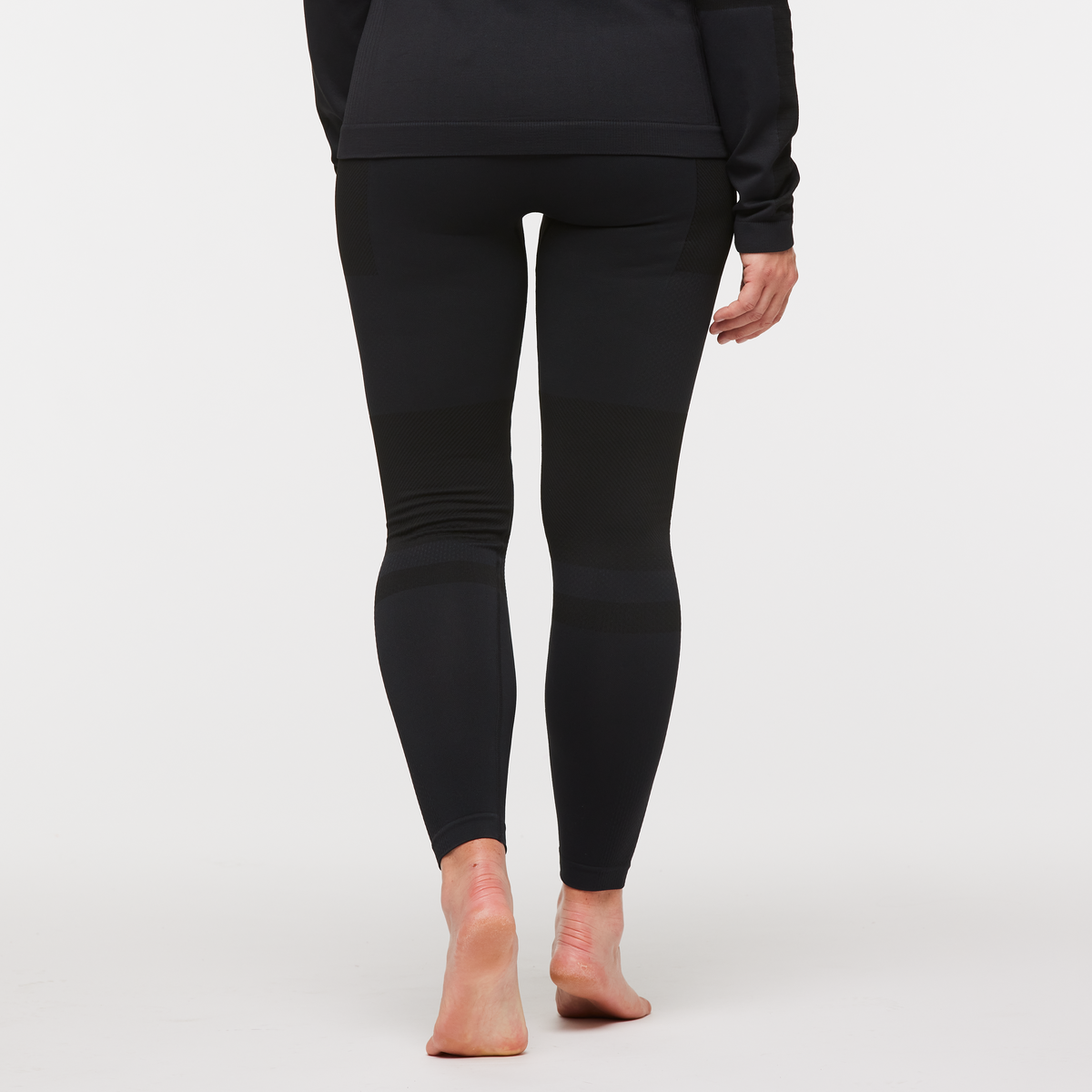 Debajo Seamless Baselayer Tight - Women's, Cotopaxi Black, Model Aya